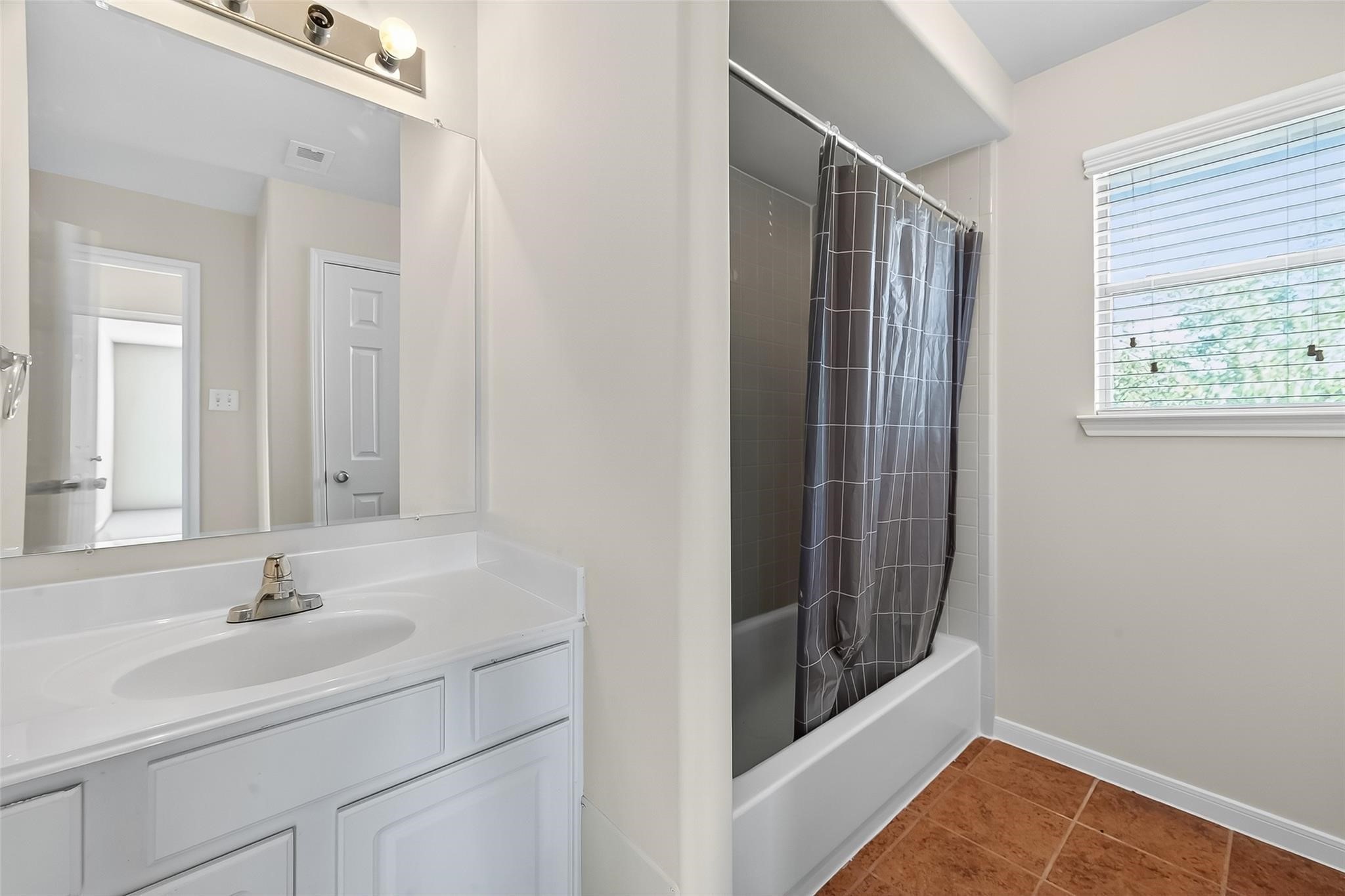 21623 Mid Peak Way Katy, TX 77449 - Photo 24 of 38 a bathroom with a sink and a mirror