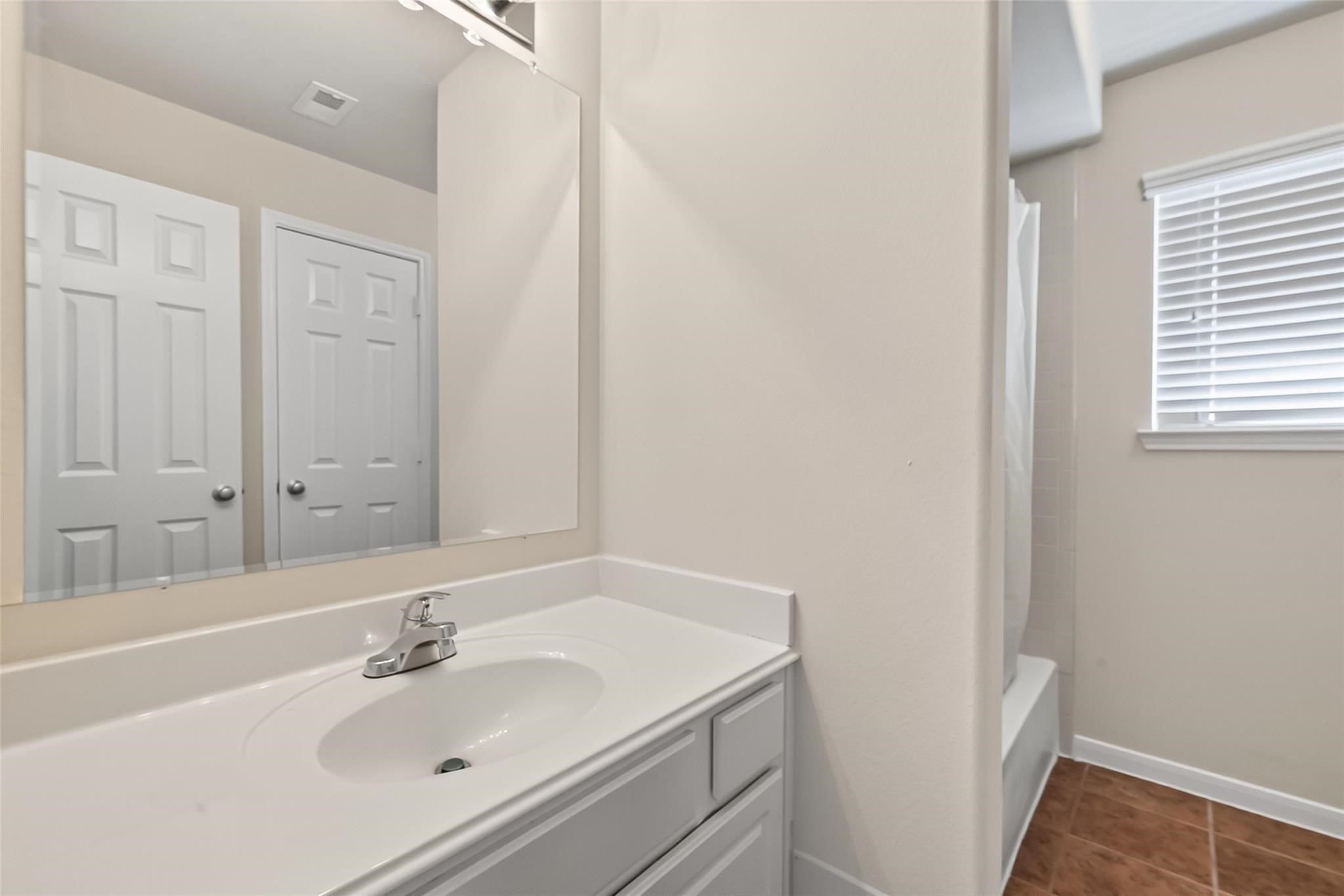21623 Mid Peak Way Katy, TX 77449 - Photo 26 of 38 a bathroom with a sink and a mirror