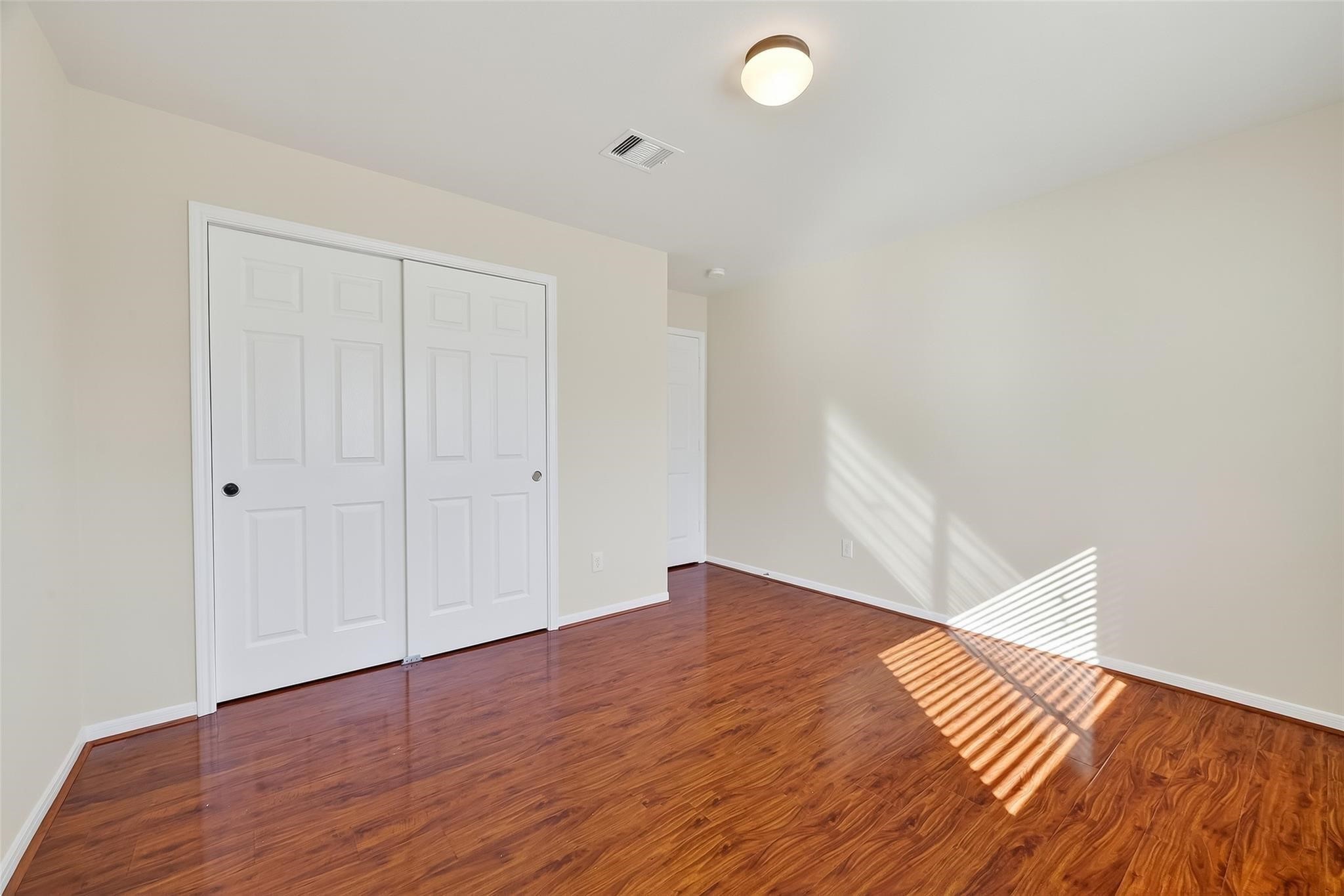 21623 Mid Peak Way Katy, TX 77449 - Photo 29 of 38 a view of an empty room with wooden floor