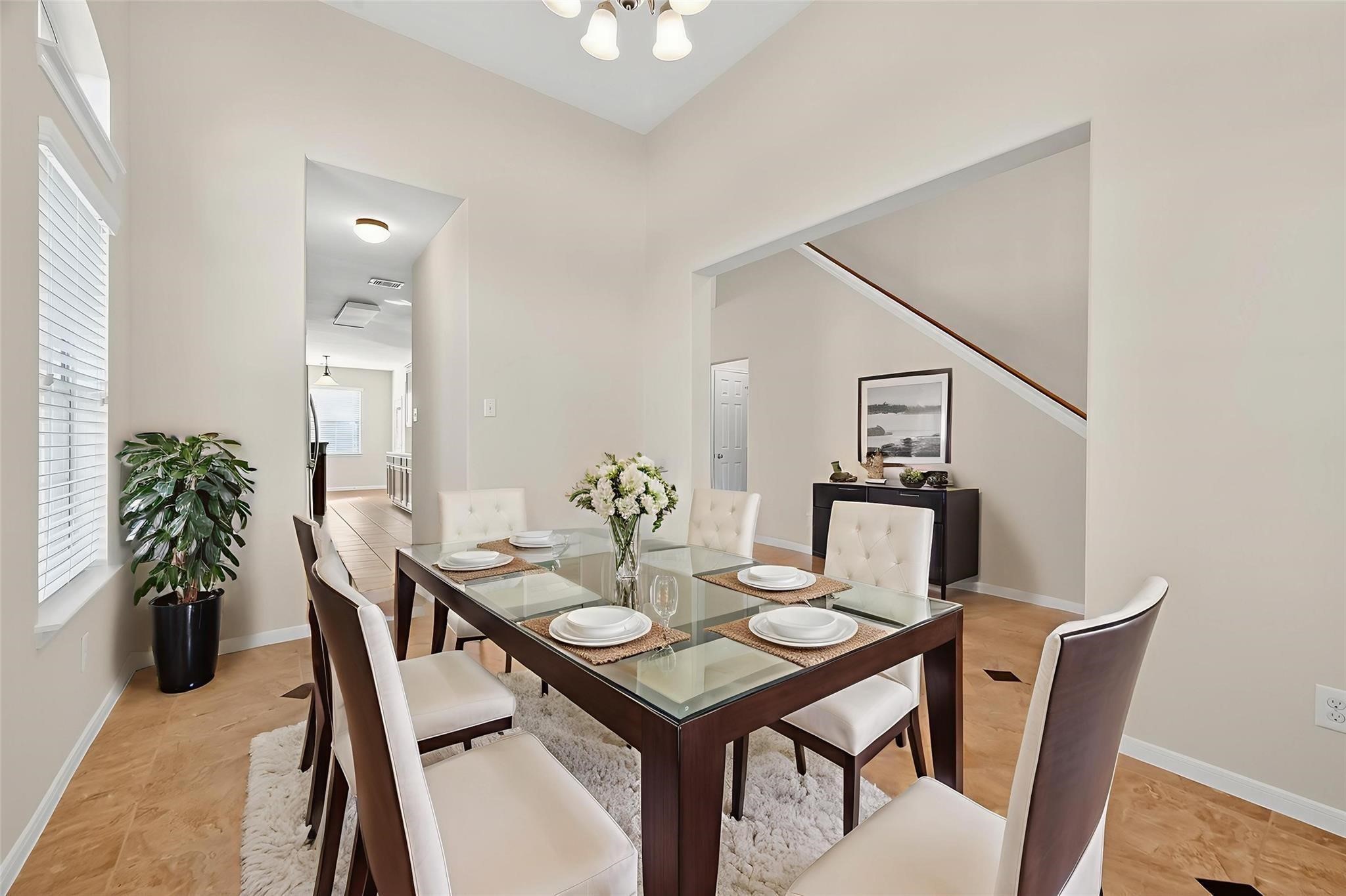 21623 Mid Peak Way Katy, TX 77449 - Photo 4 of 38 a view of a dining room with furniture and wooden floor