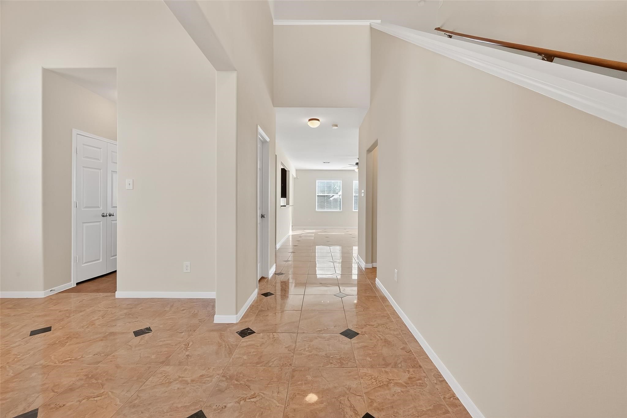 21623 Mid Peak Way Katy, TX 77449 - Photo 8 of 38 a view of a hallway with wooden floor and a bathroom