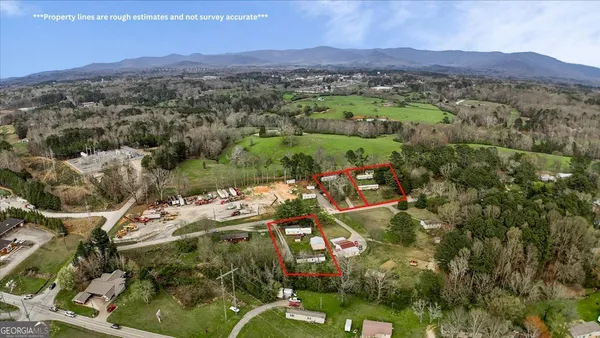 an aerial view of residential house with outdoor space and mountain view