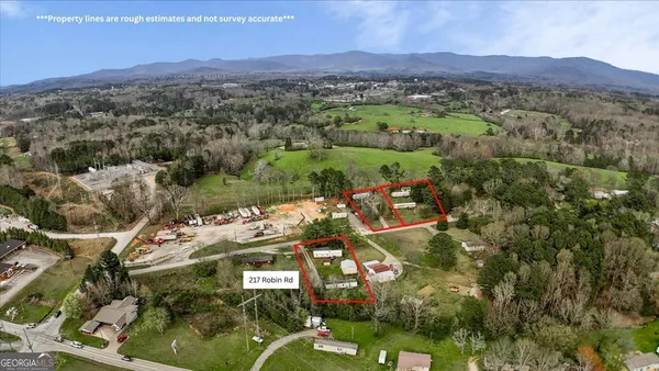 an aerial view of residential house with outdoor space