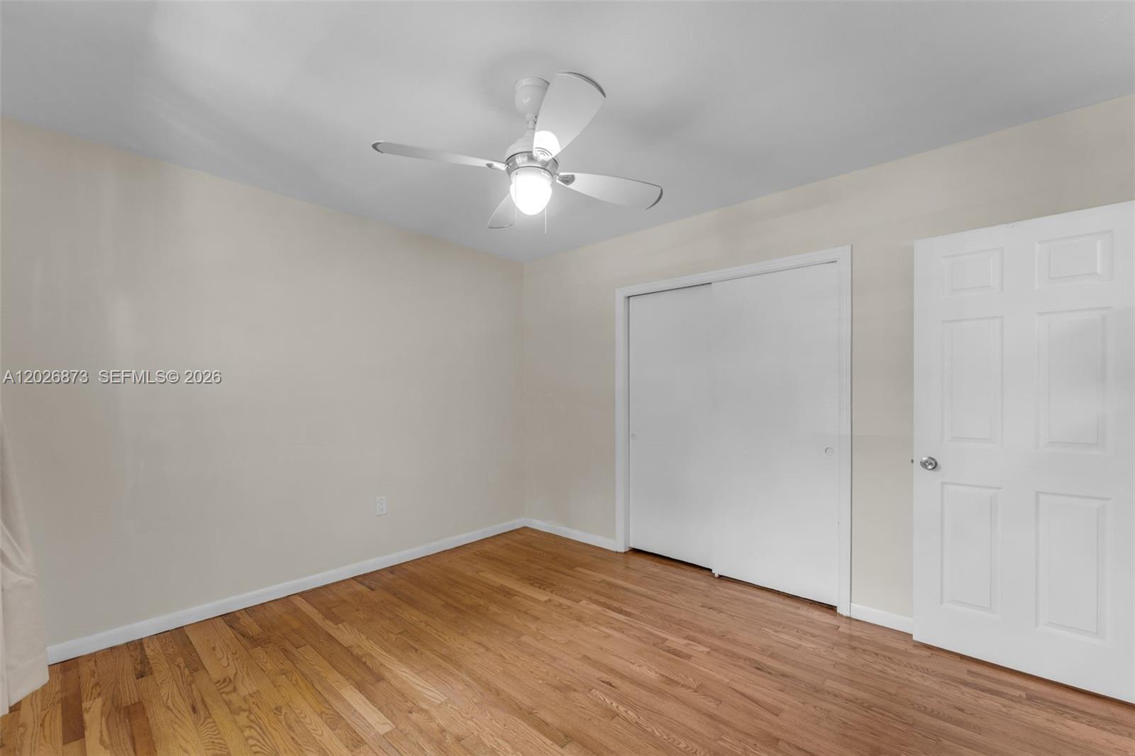5590 Southwest 78th Street, Unit 133B Miami, FL 33143 - Photo 9 of 18 a view of empty room with wooden floor