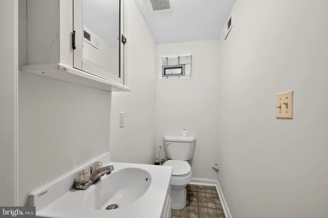 a bathroom with a sink and a toilet
