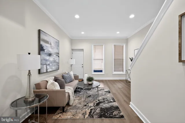 a living room with furniture and a rug