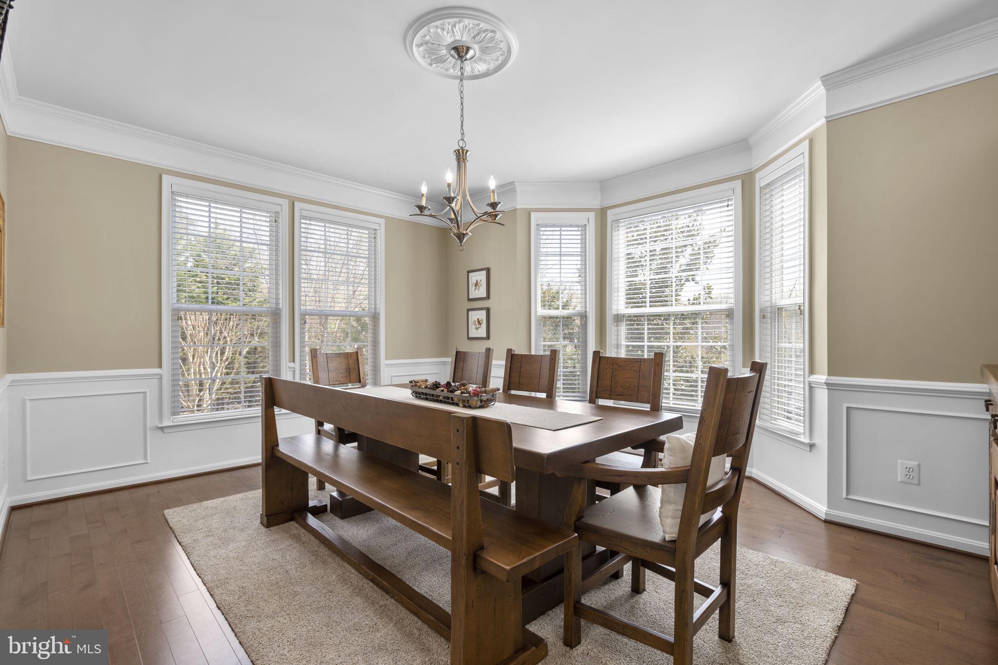 9323 Castle Hill Road Springfield, VA 22153 - Photo 13 of 95 a view of a dining room with furniture window and wooden floor
