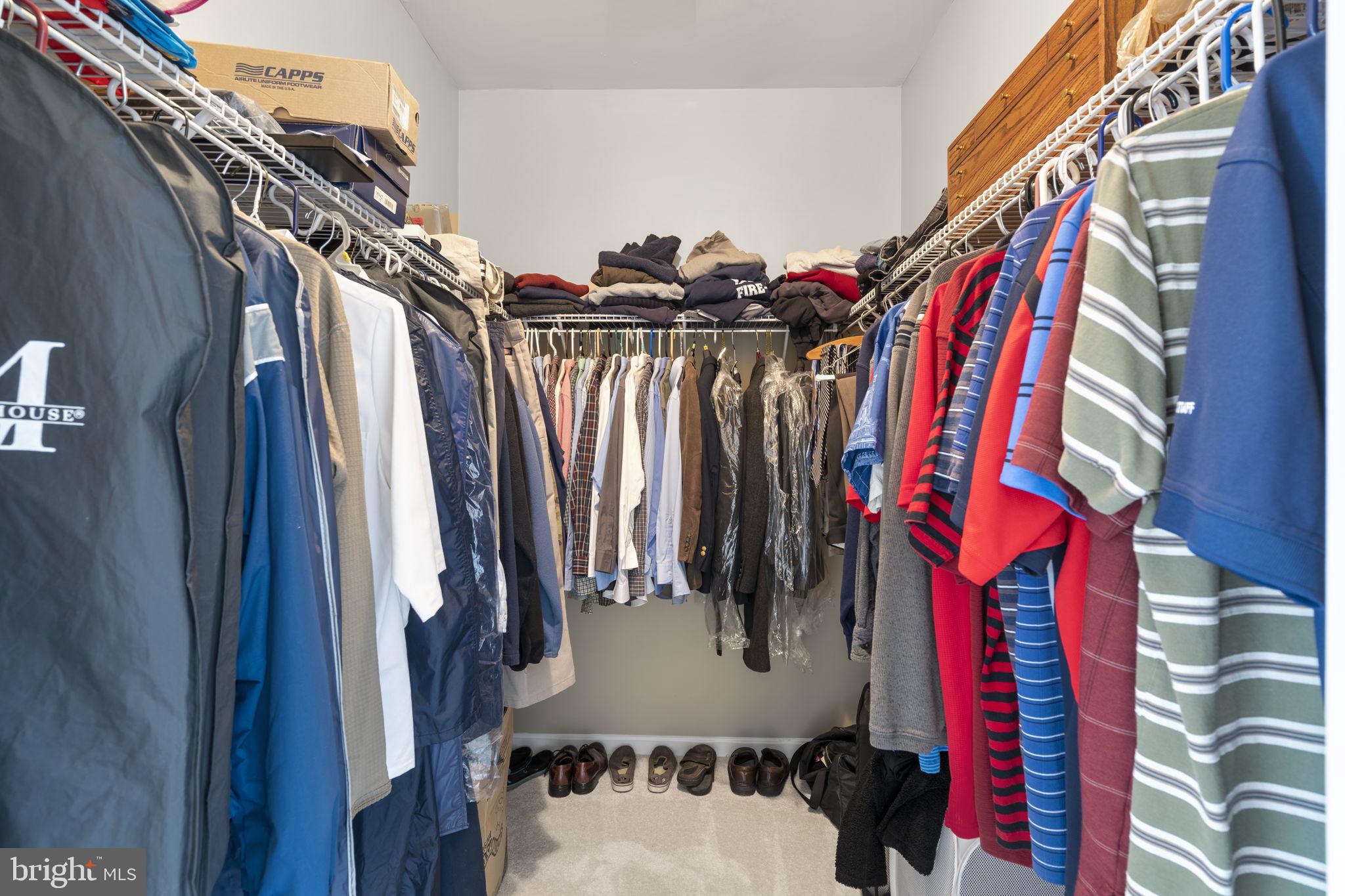 9323 Castle Hill Road Springfield, VA 22153 - Photo 40 of 95 a view of walk in closet with clothes and shoes