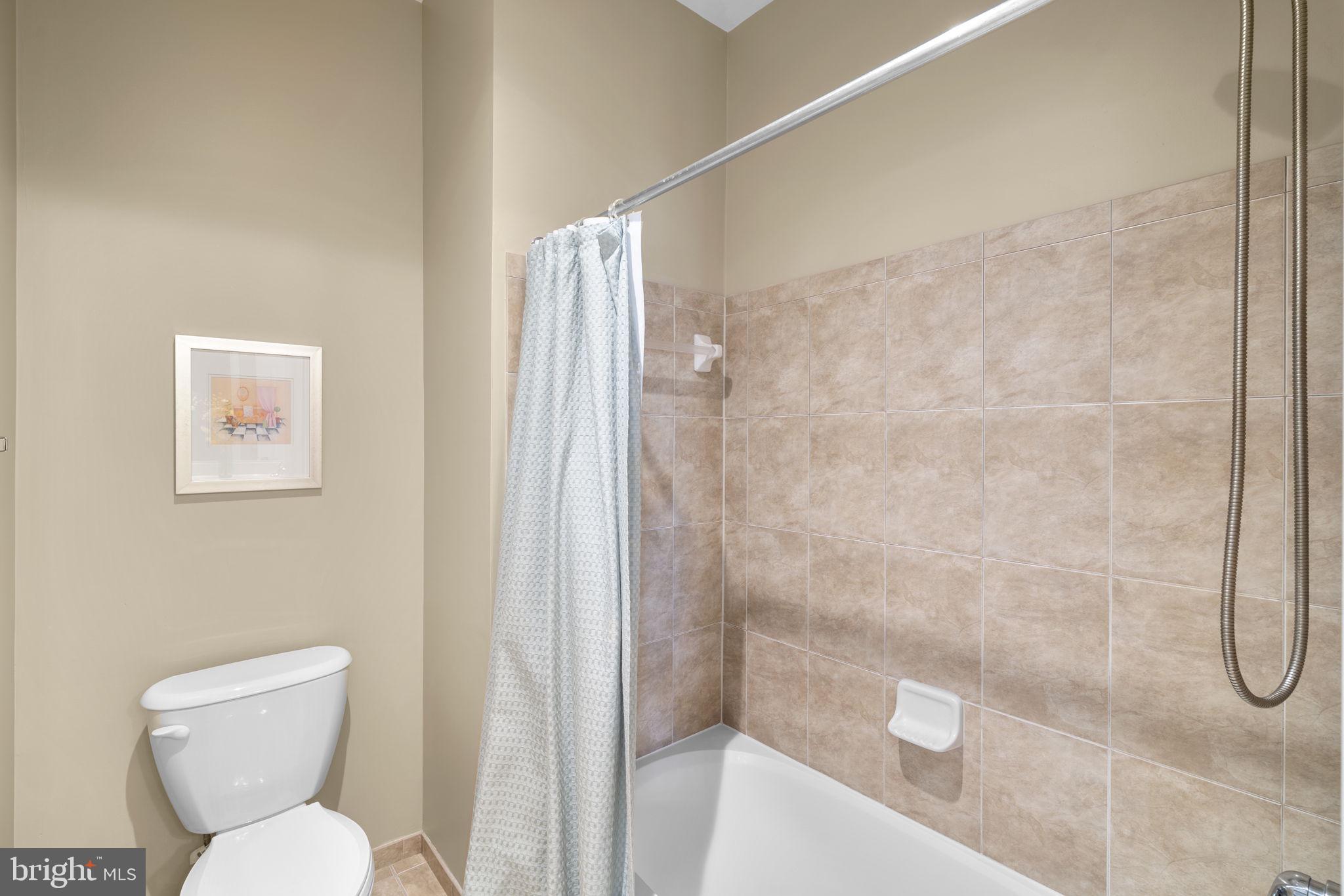 9323 Castle Hill Road Springfield, VA 22153 - Photo 49 of 95 a bathroom with a toilet and a shower