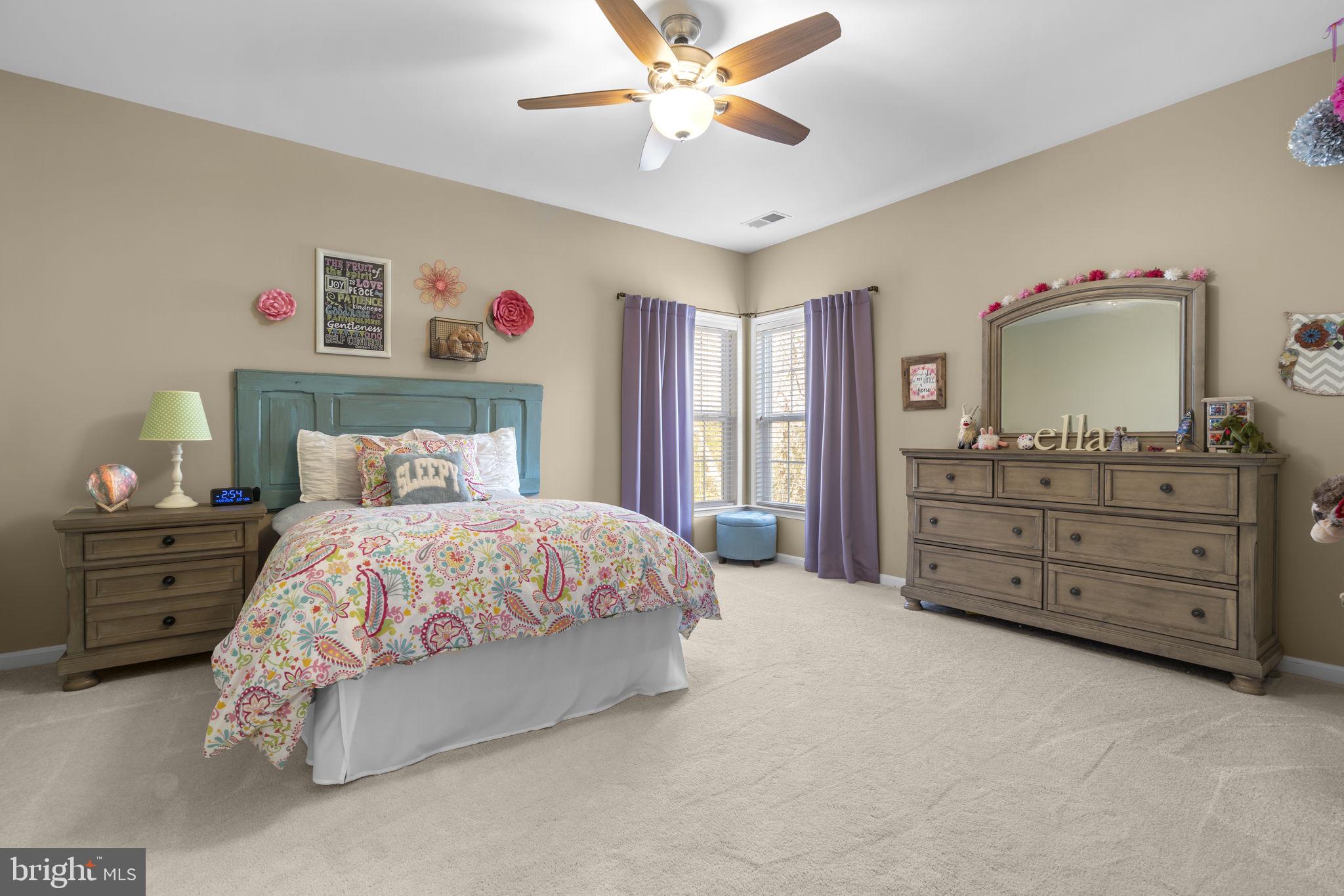 9323 Castle Hill Road Springfield, VA 22153 - Photo 50 of 95 a bedroom with a bed and a dresser