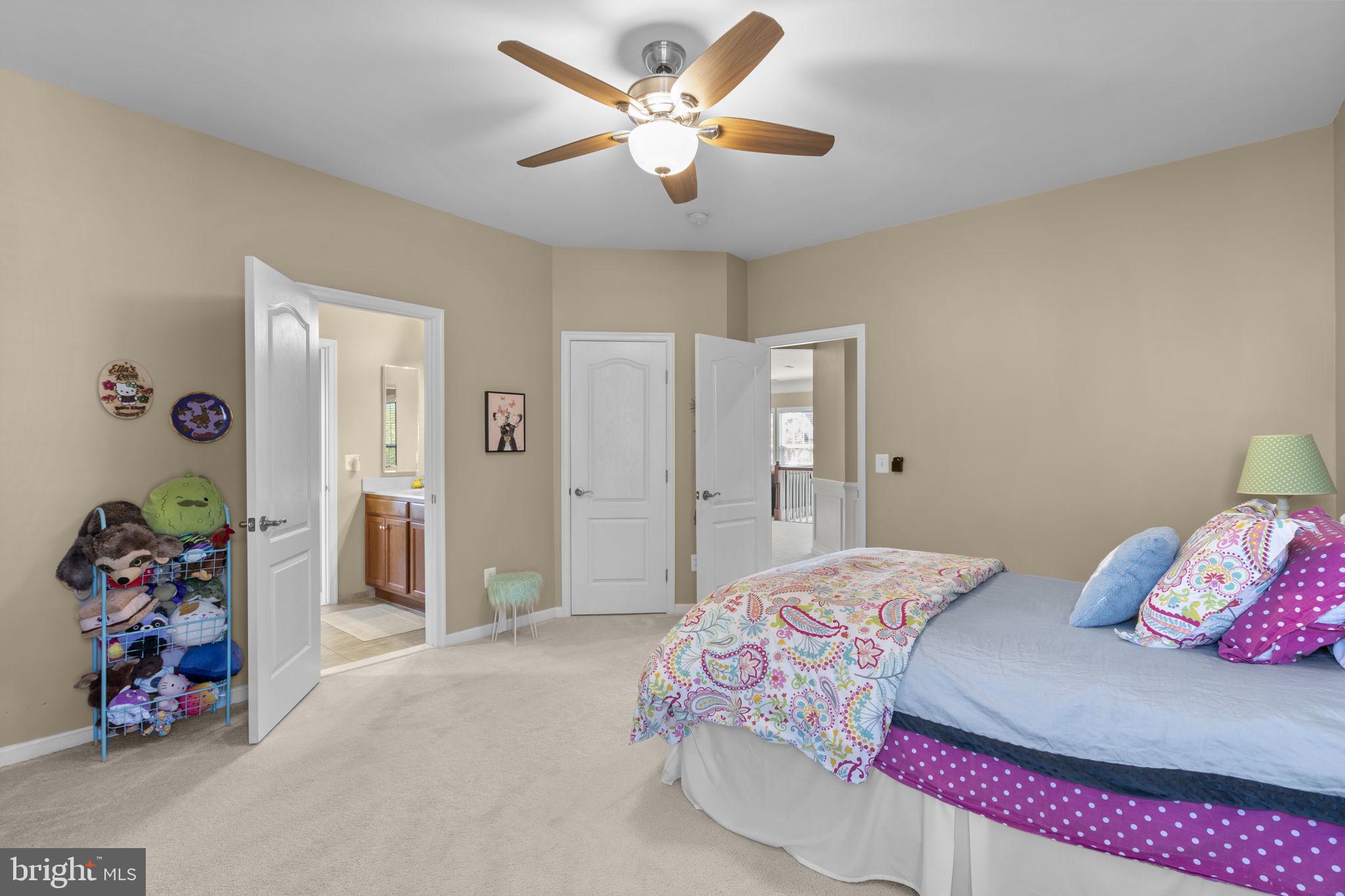 9323 Castle Hill Road Springfield, VA 22153 - Photo 52 of 95 a bedroom with a bed and a chandelier