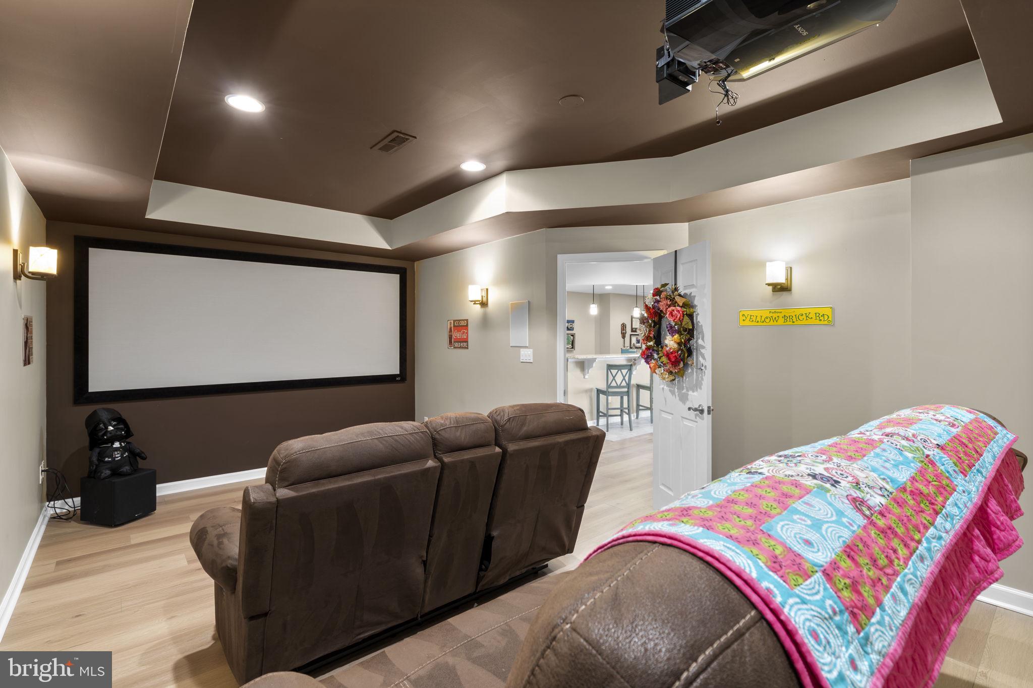 9323 Castle Hill Road Springfield, VA 22153 - Photo 59 of 95 a living room with furniture and a flat screen tv