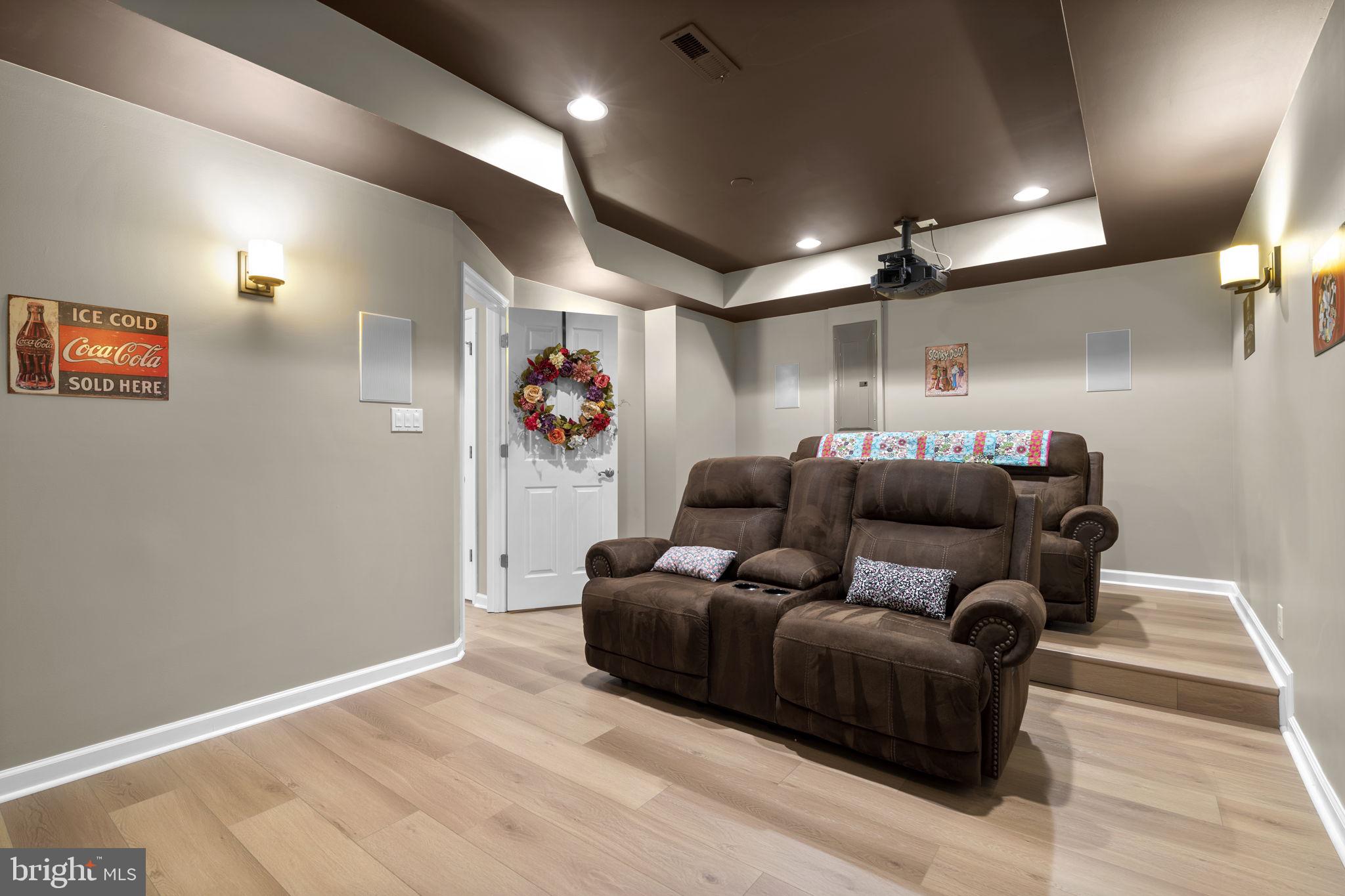 9323 Castle Hill Road Springfield, VA 22153 - Photo 60 of 95 a living room with furniture and a flat screen tv