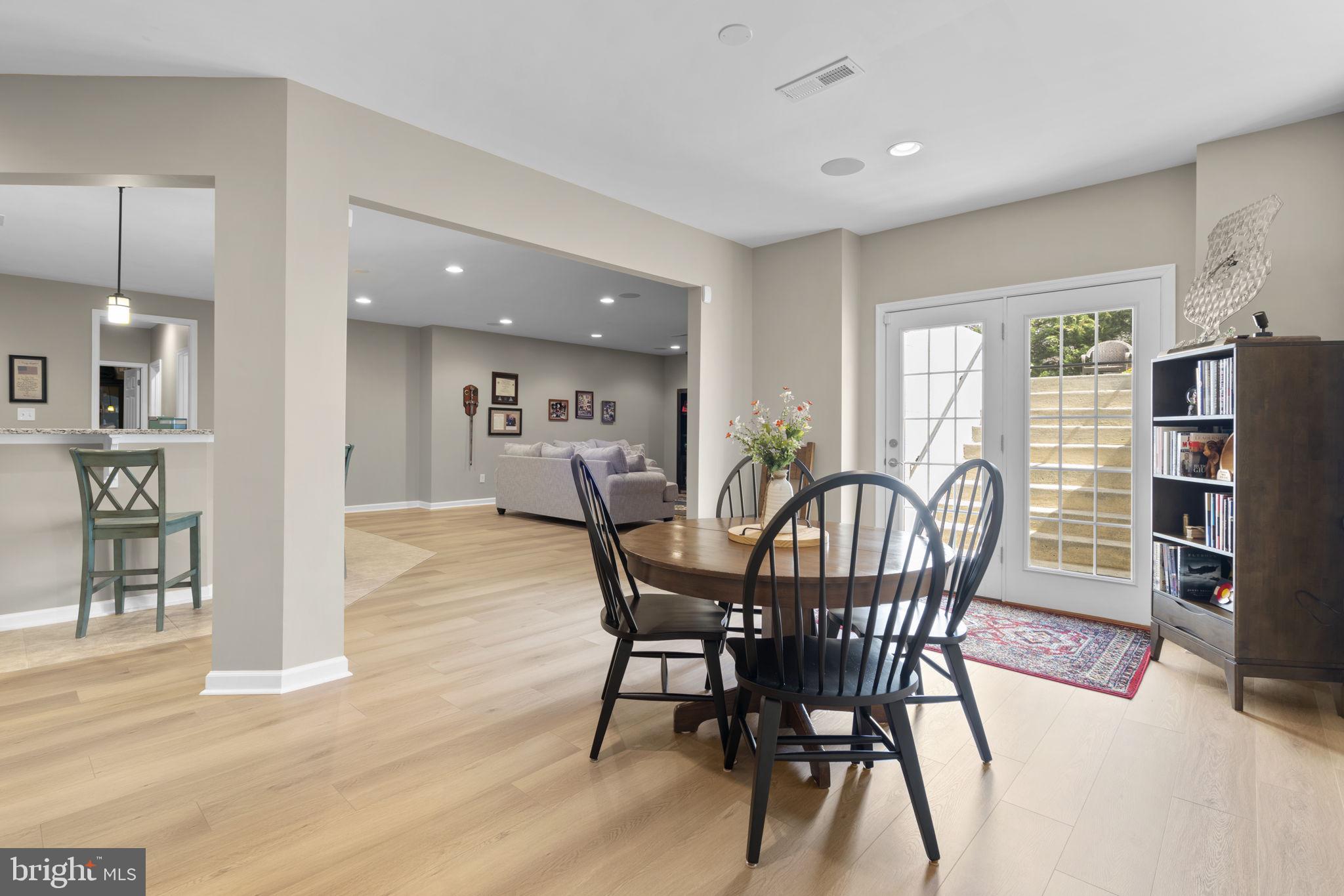 9323 Castle Hill Road Springfield, VA 22153 - Photo 72 of 95 a view of a dining room with furniture and wooden floor