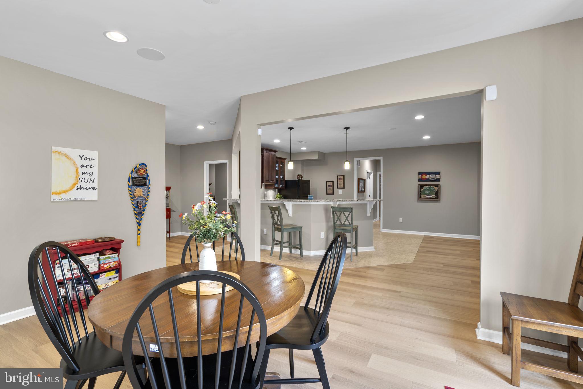 9323 Castle Hill Road Springfield, VA 22153 - Photo 73 of 95 a view of a dining room with furniture and wooden floor