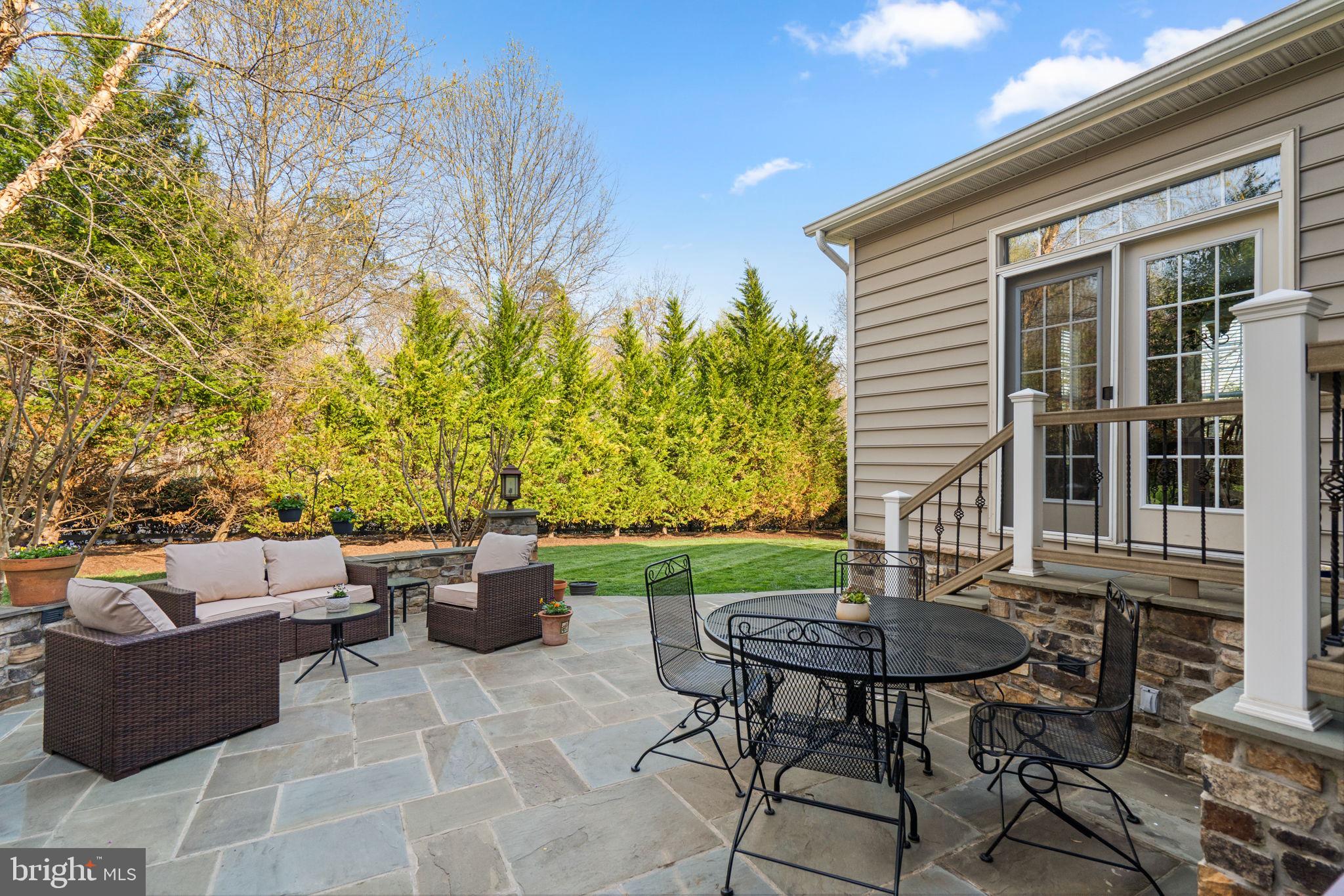 9323 Castle Hill Road Springfield, VA 22153 - Photo 75 of 95 a view of backyard of house with seating space