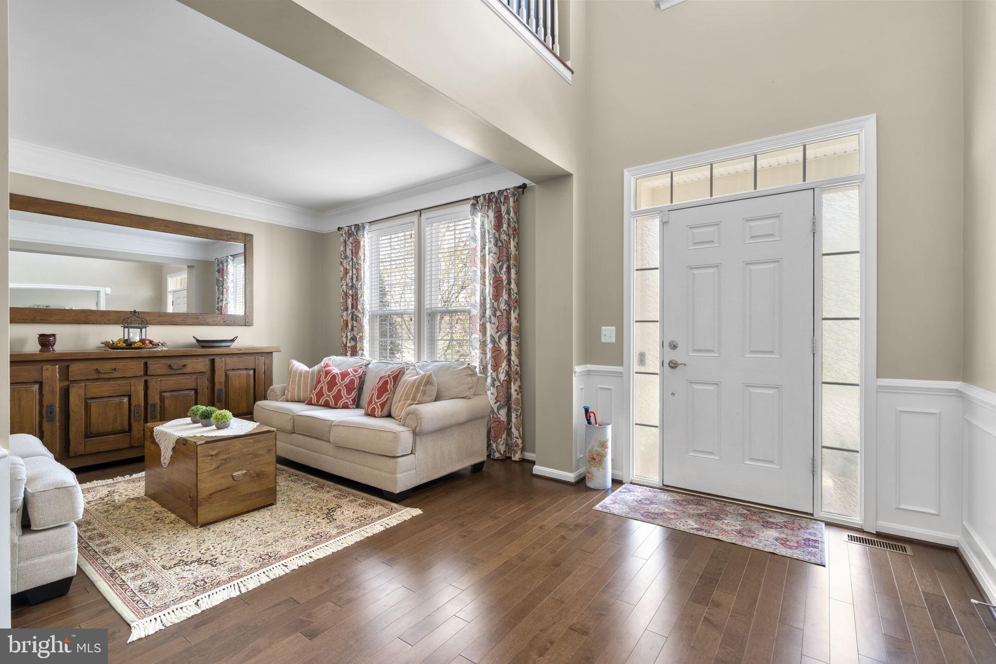 9323 Castle Hill Road Springfield, VA 22153 - Photo 8 of 95 a living room with furniture and wooden floor