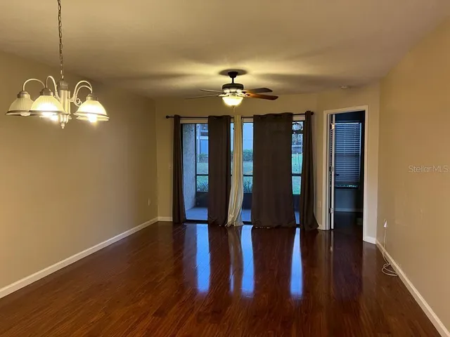 a view of a livingroom with wooden floor