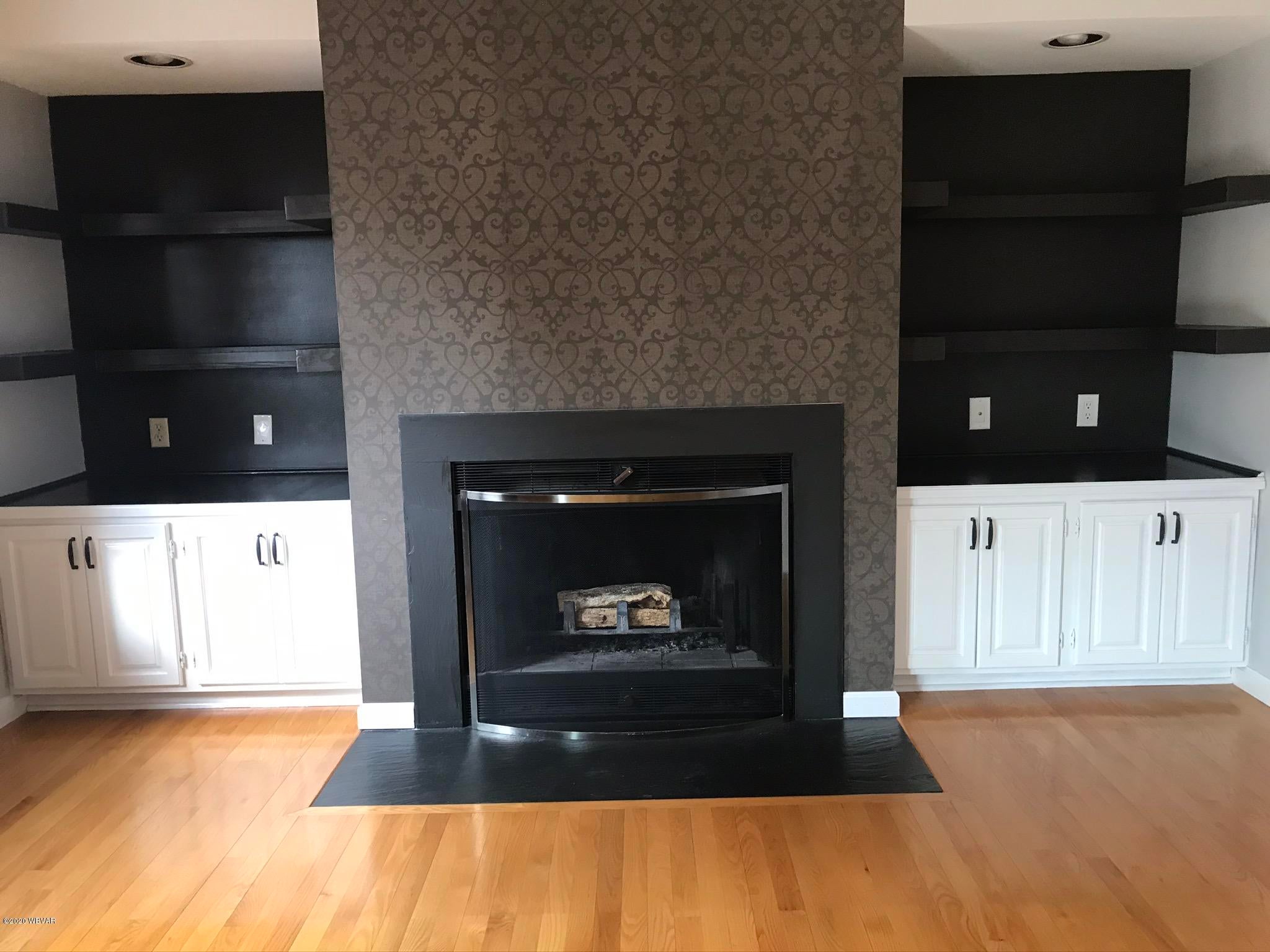 735 Heilman Road Montoursville, PA 17754 - Photo 15 of 33 Dining Room Fireplace with Shelving