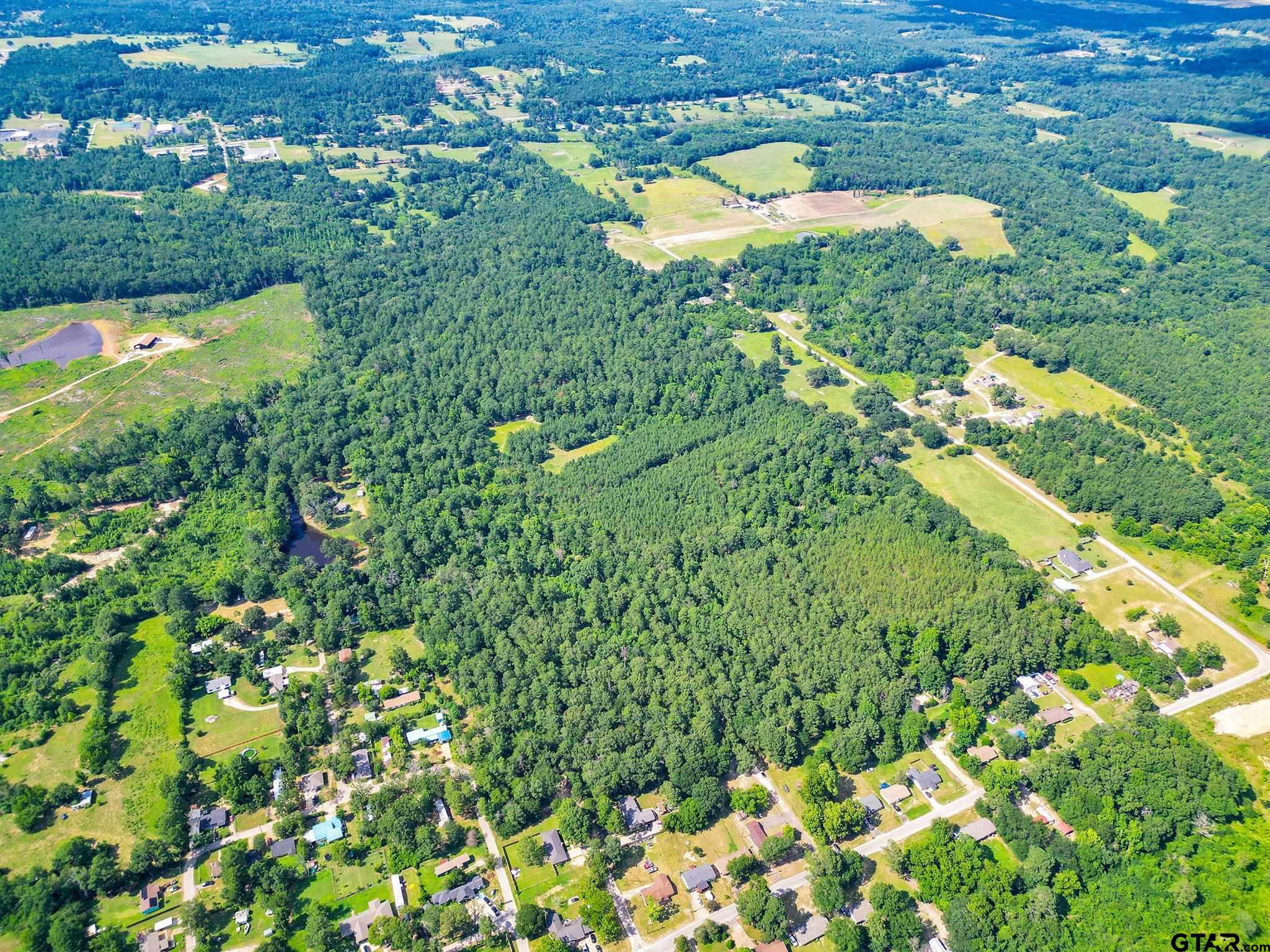 10114 C R 272 Tyler, TX 75702 - Photo 11 of 36 an aerial view of residential houses with outdoor space and trees