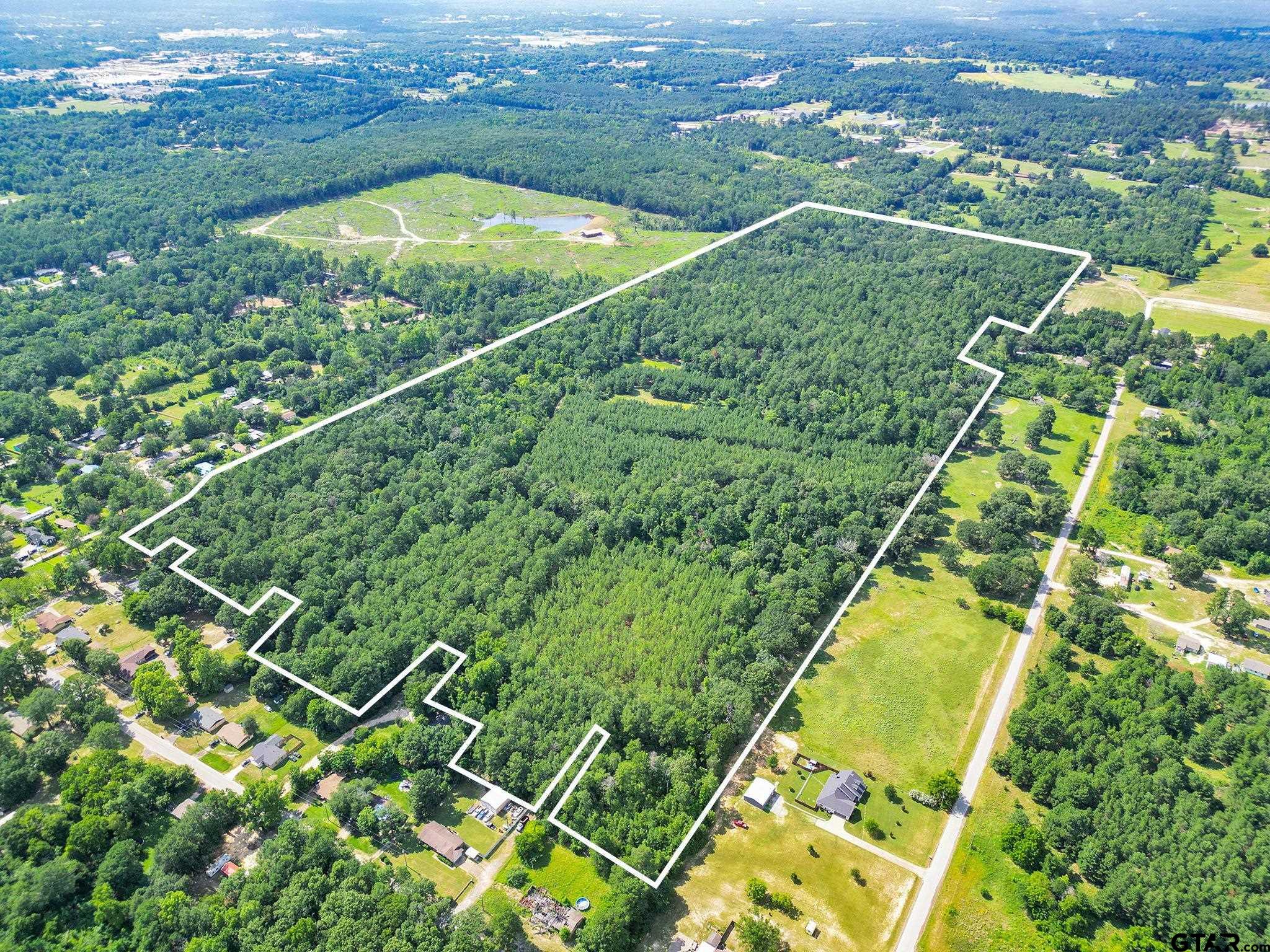 10114 C R 272 Tyler, TX 75702 - Photo 7 of 36 an aerial view of residential houses with outdoor space and city view