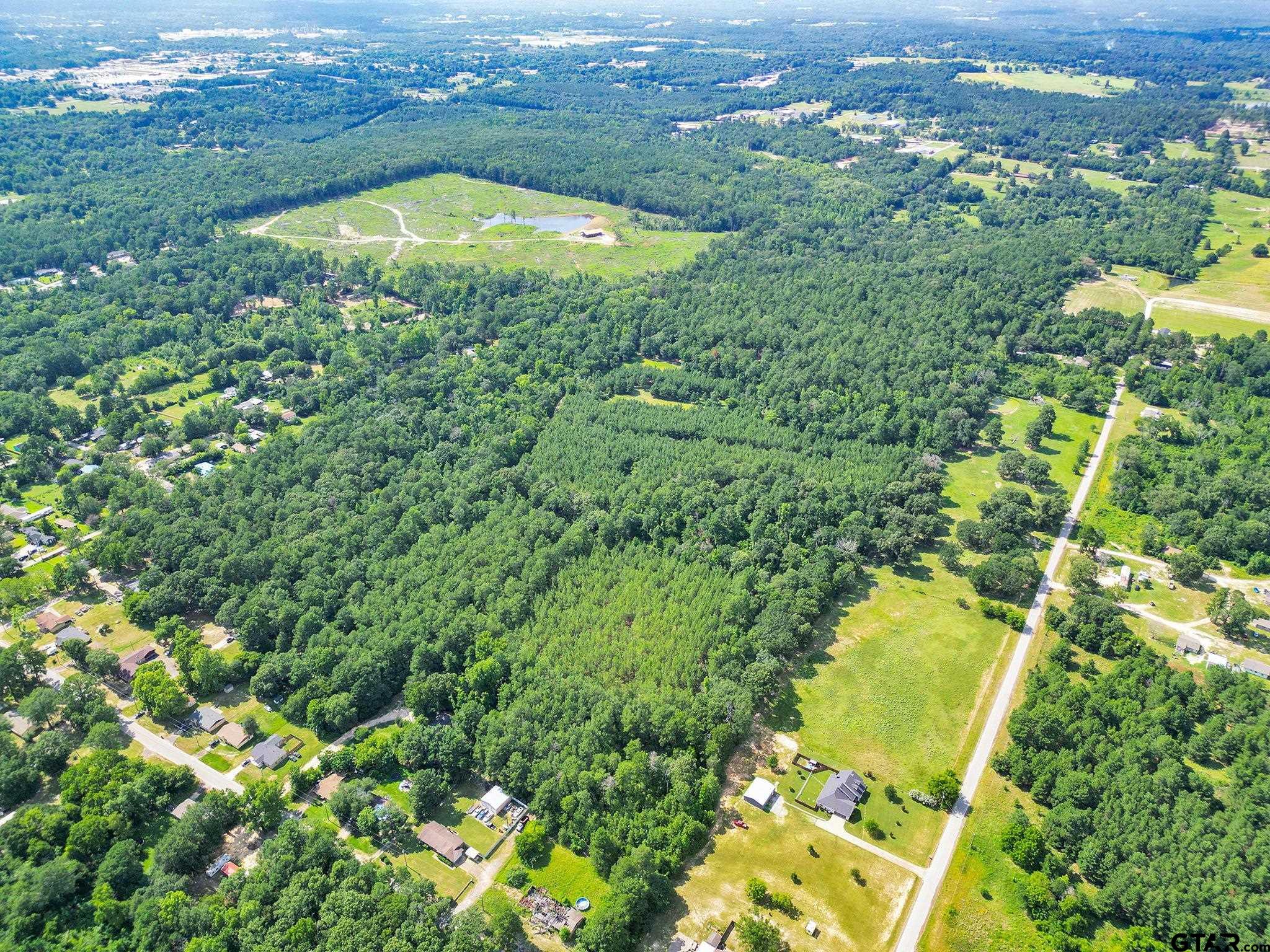 10114 C R 272 Tyler, TX 75702 - Photo 8 of 36 an aerial view of residential houses with outdoor space and trees