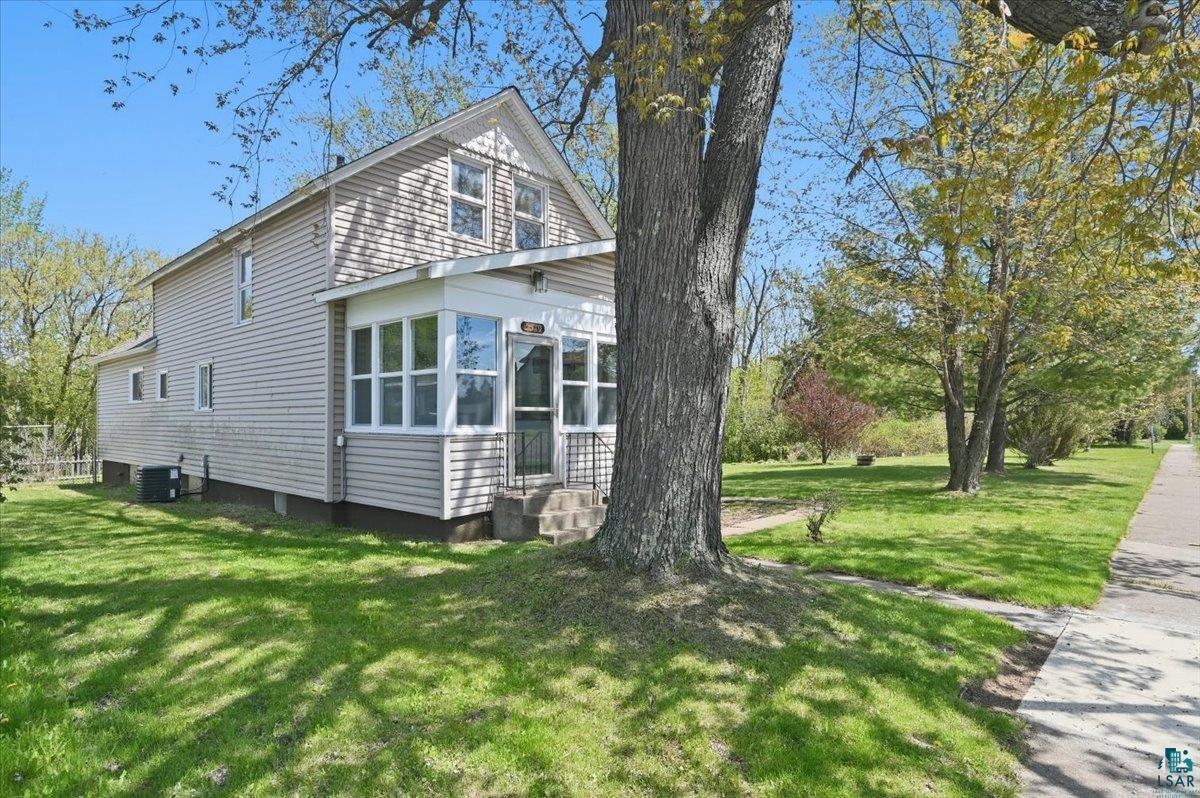 5319 East 3rd Street Superior, WI 54880 - Photo 2 of 33 Two-story residence featuring light-colored siding and a covered front porch with multiple windows
