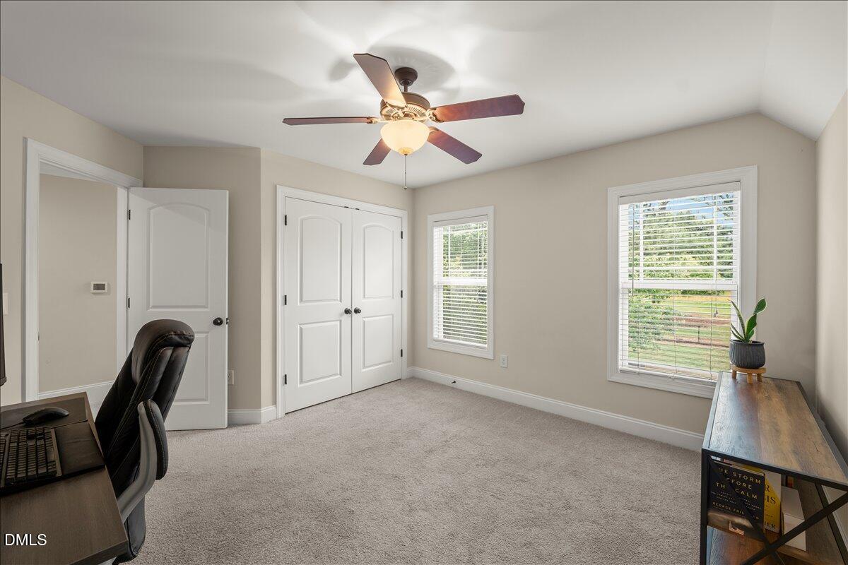 7400 Denlee Road Raleigh, NC 27603 - Photo 28 of 47 a view of a livingroom with a window and a ceiling fan
