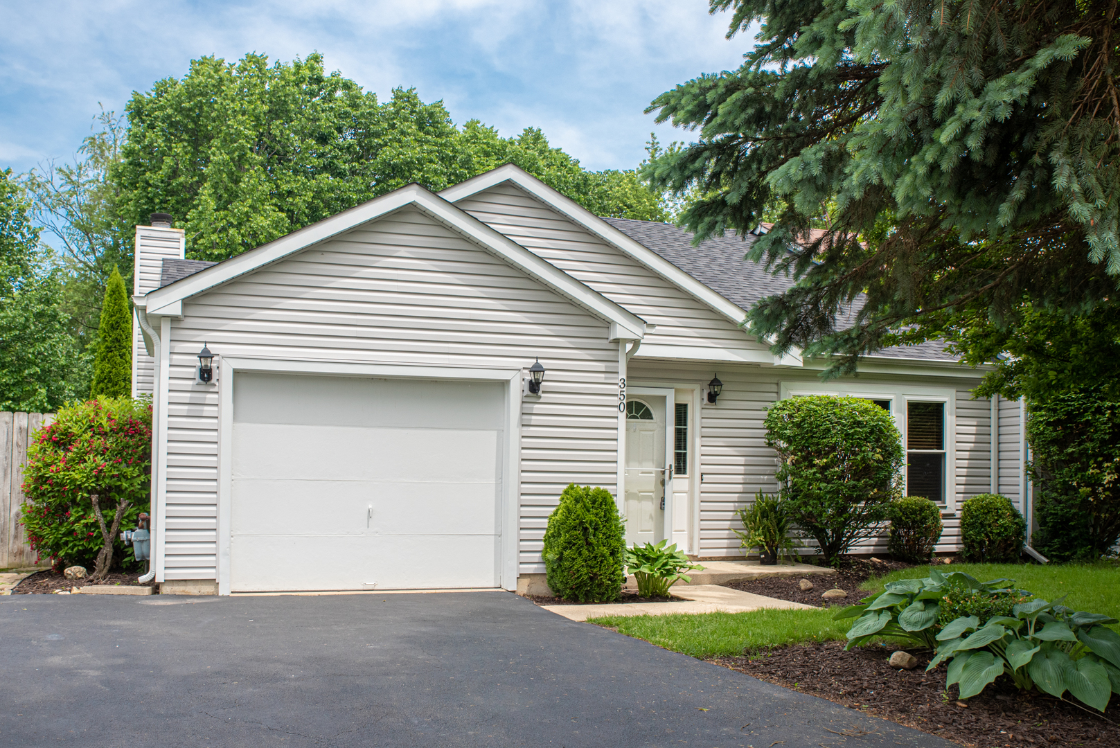 350 Chaparral Circle Elgin, IL 60120 - Photo 1 of 28 a view of a house with a yard and plants