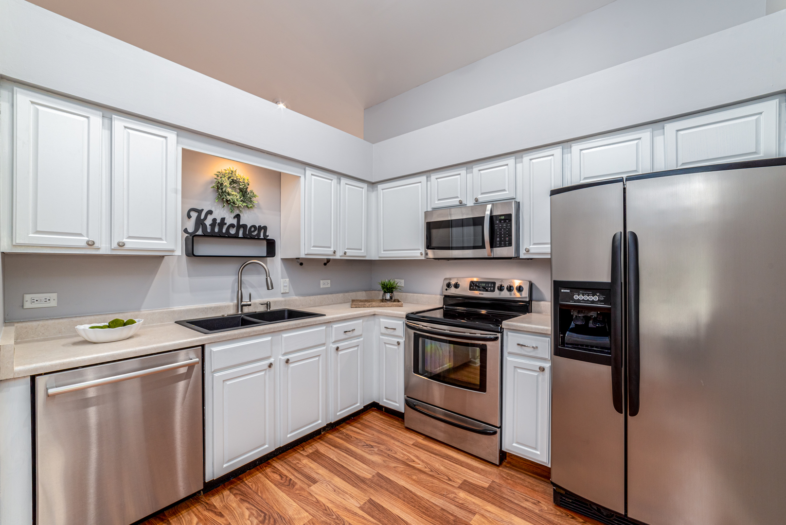 350 Chaparral Circle Elgin, IL 60120 - Photo 2 of 28 a kitchen with stainless steel appliances granite countertop a stove a sink and a refrigerator