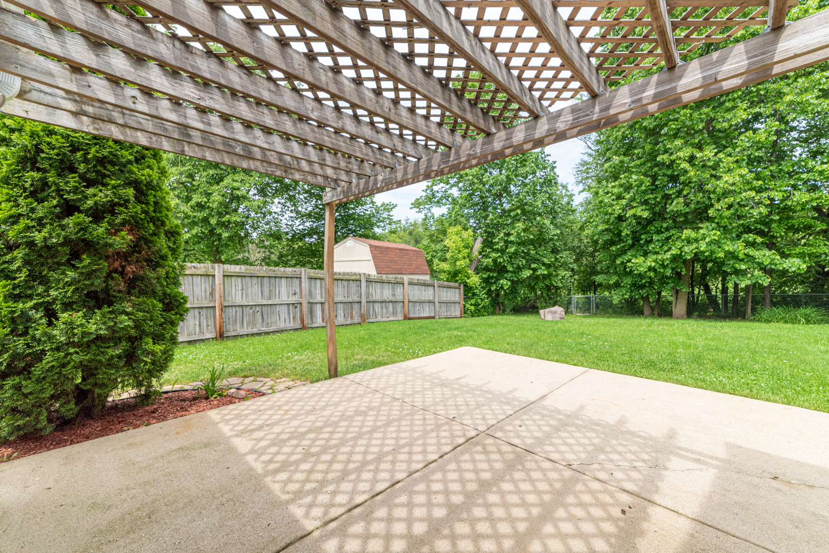 350 Chaparral Circle Elgin, IL 60120 - Photo 20 of 28 a view of a big room next to a yard with large trees