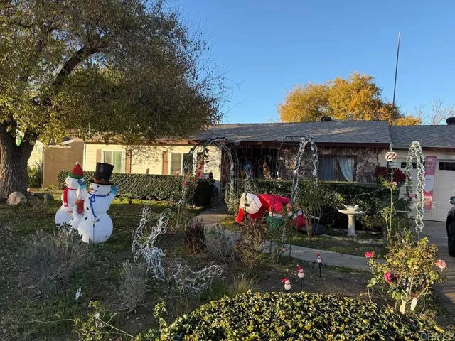 a view of a chairs and tables in the patio and a fire pit