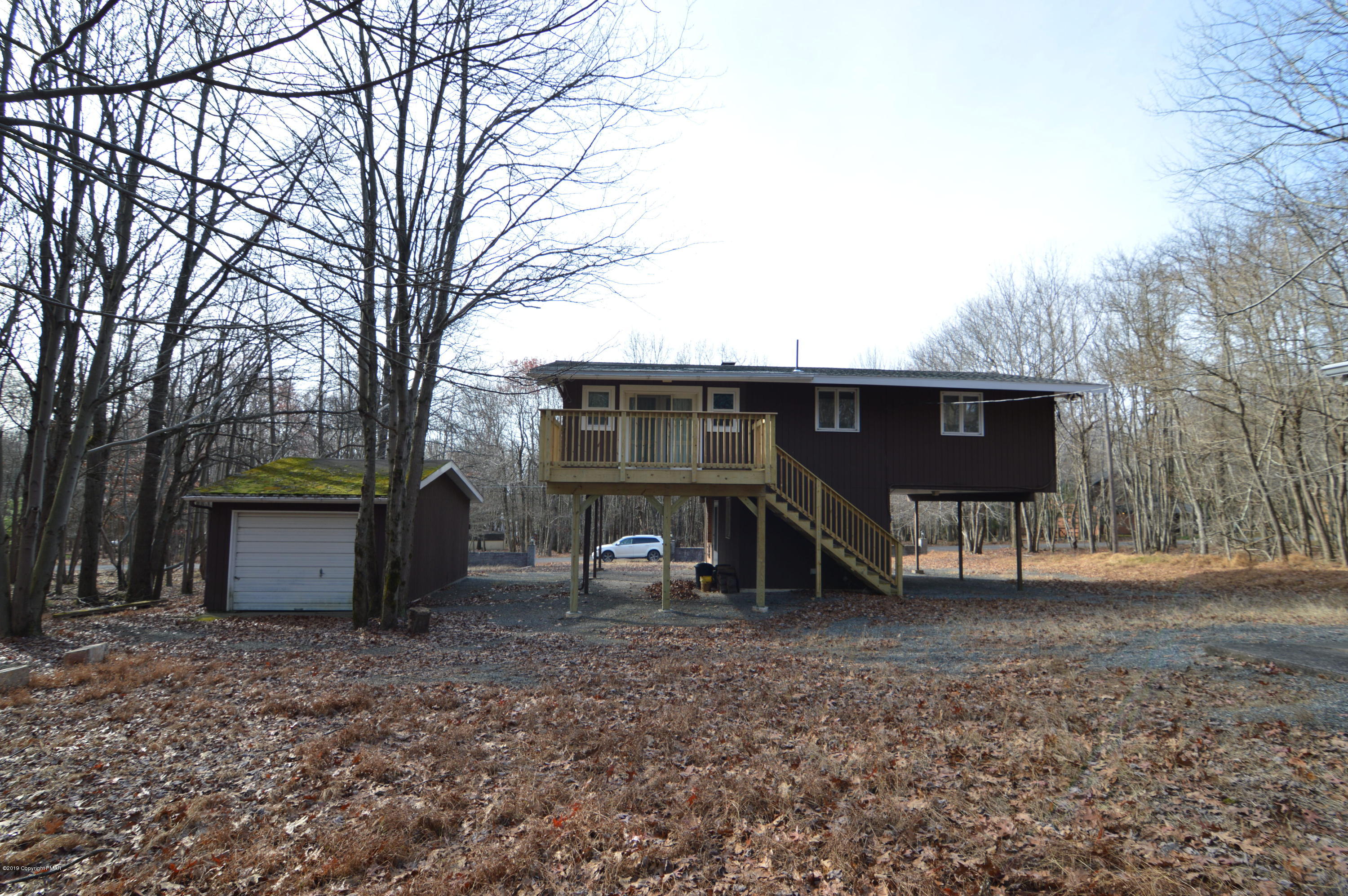 139 Maple Road Blakeslee, PA 18610 - Photo 3 of 29 a view of a house with a yard and a tree
