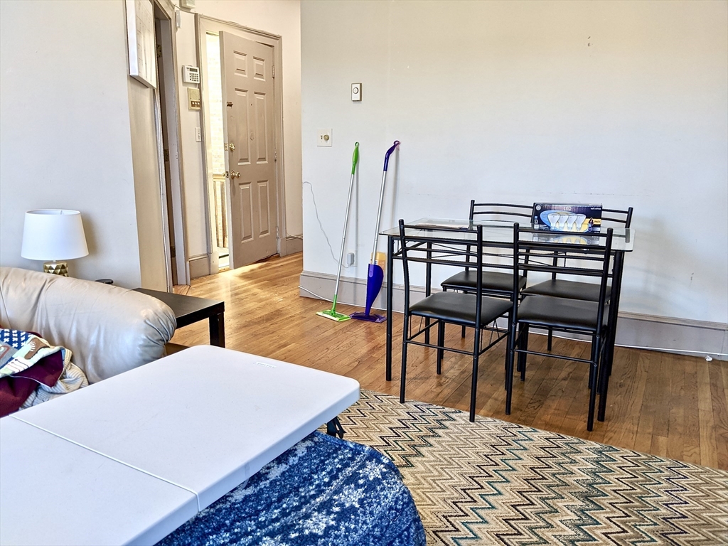 616 Columbus Avenue, Unit 7 Boston, MA 02118 - Photo 23 of 25 a bedroom with two beds and a table