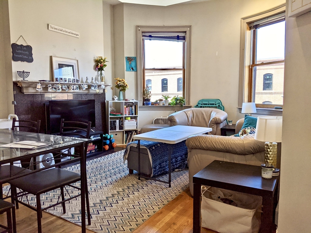 616 Columbus Avenue, Unit 7 Boston, MA 02118 - Photo 5 of 25 a living room with furniture and a flat screen tv