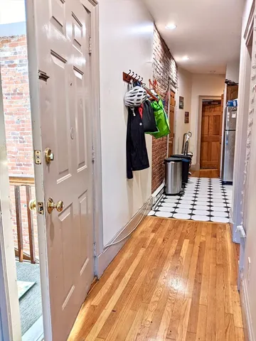 a kitchen with a refrigerator and a stove top oven