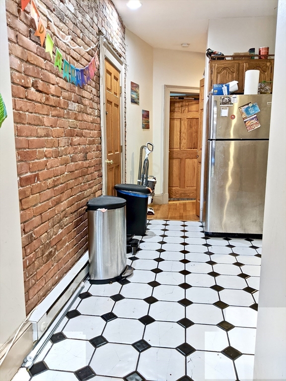 616 Columbus Avenue, Unit 7 Boston, MA 02118 - Photo 10 of 25 a kitchen with a refrigerator and a stove top oven