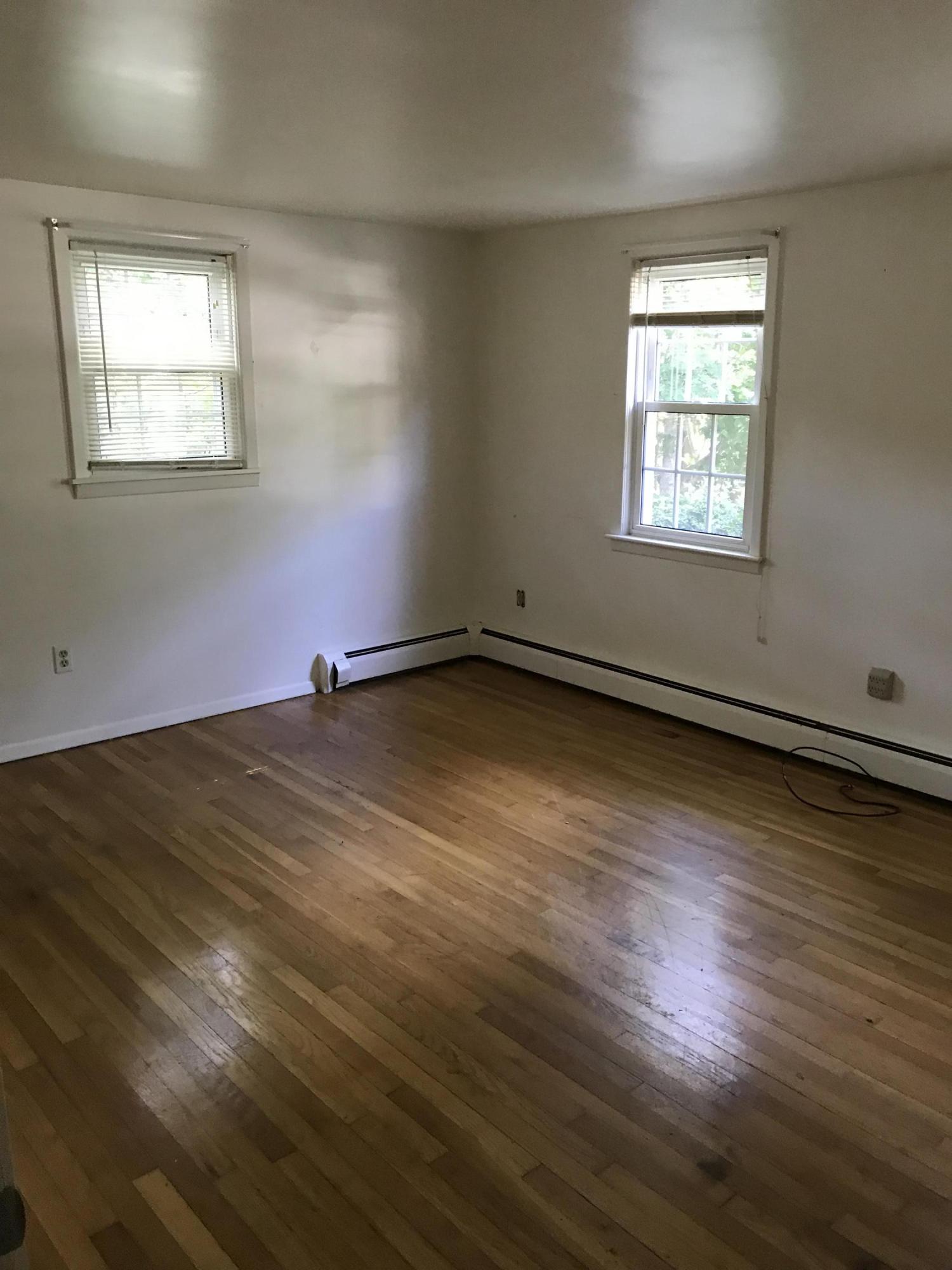 18 Stoney Cliff Road Centerville, MA 02632 - Photo 6 of 14 a view of a room with wooden floor and window