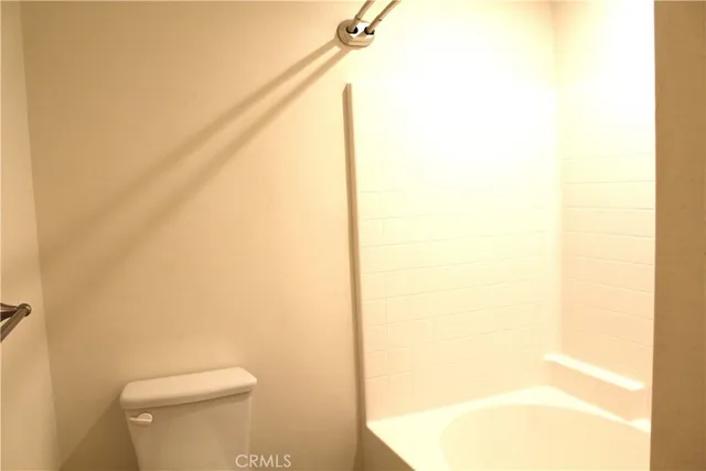 a bathroom with a toilet and a vanity