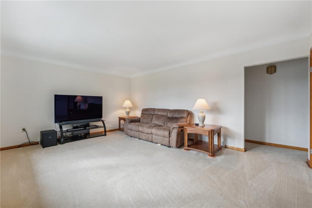 2480 Lynnrose Drive Irwin, PA 15642 - Photo 15 of 39 a living room with furniture and a flat screen tv