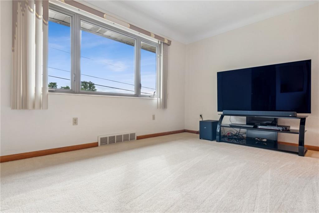 2480 Lynnrose Drive Irwin, PA 15642 - Photo 16 of 39 a view of room with window and flat screen tv