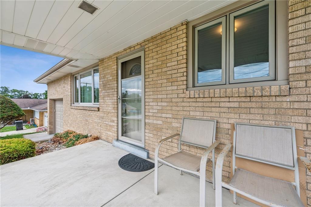 2480 Lynnrose Drive Irwin, PA 15642 - Photo 3 of 39 a backyard of a house with table and chairs