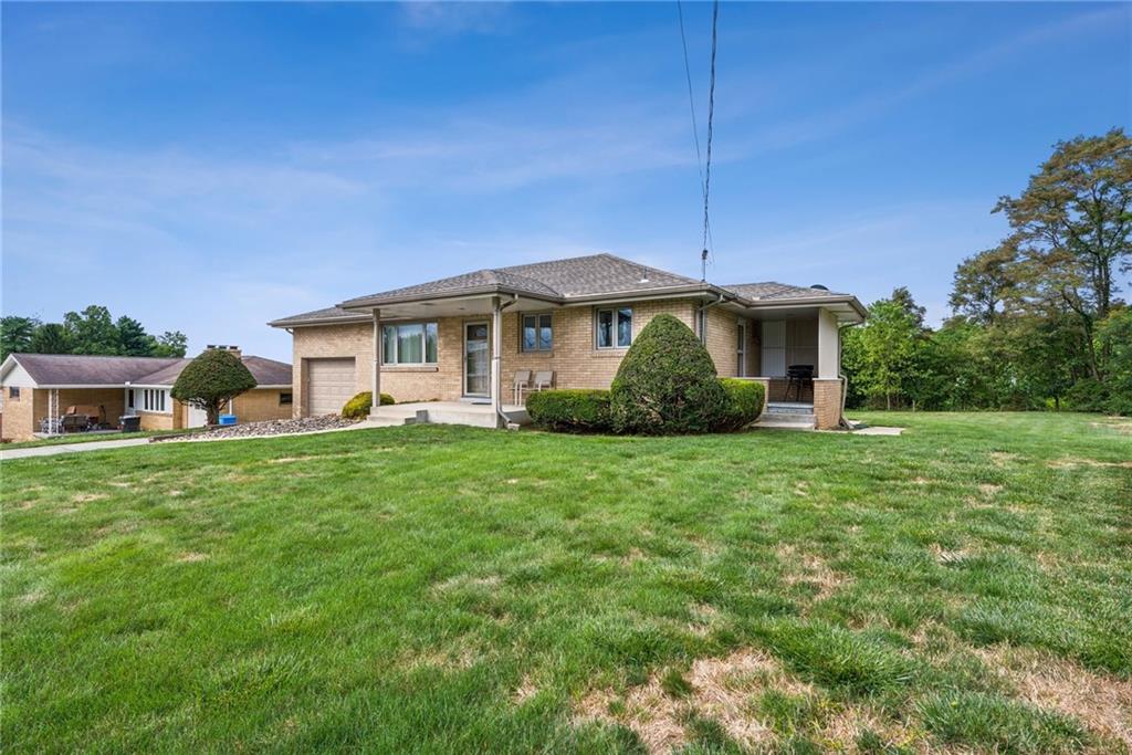 2480 Lynnrose Drive Irwin, PA 15642 - Photo 35 of 39 a front view of house with a garden