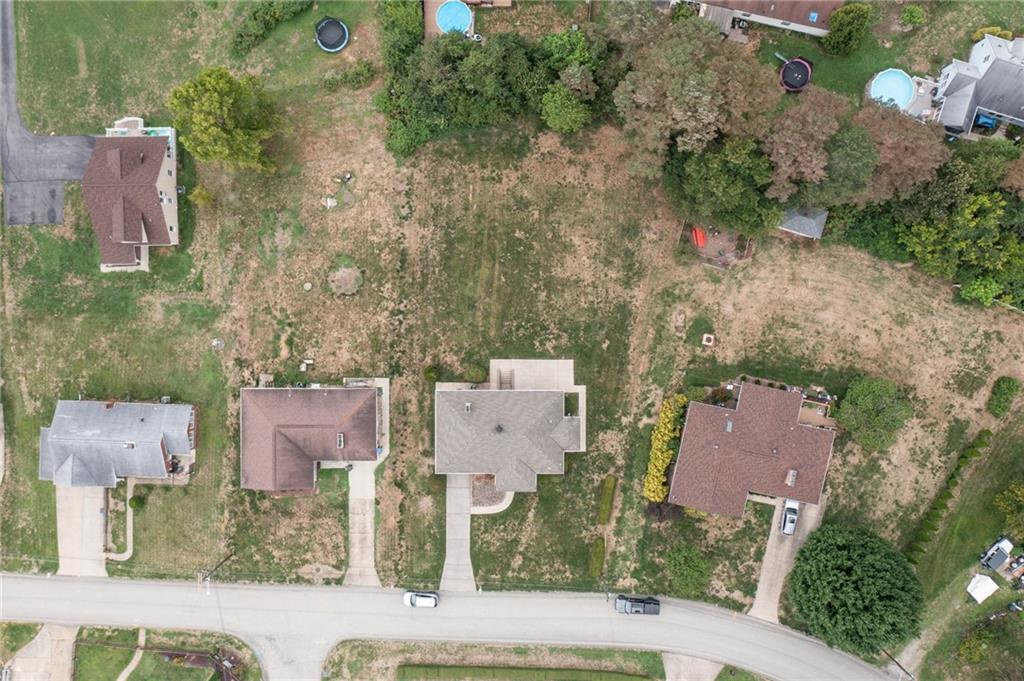 2480 Lynnrose Drive Irwin, PA 15642 - Photo 37 of 39 an aerial view of a house with a yard and lake view