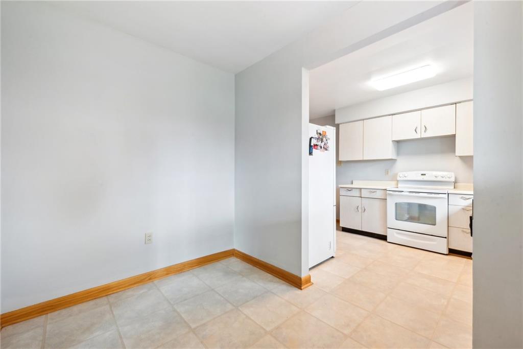 2480 Lynnrose Drive Irwin, PA 15642 - Photo 6 of 39 a kitchen with stainless steel appliances a white stove top oven and white cabinet