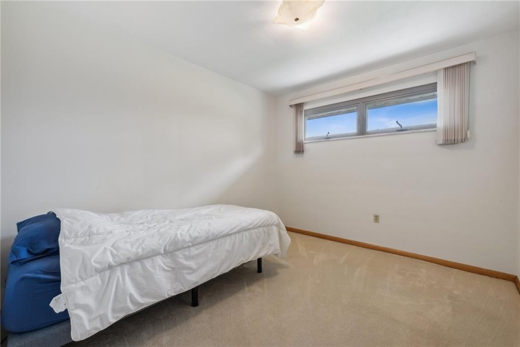 2480 Lynnrose Drive Irwin, PA 15642 - Photo 10 of 39 a bedroom with a bed and wall painting