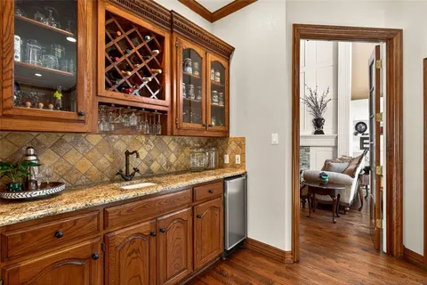 a kitchen with stainless steel appliances granite countertop a sink and cabinets