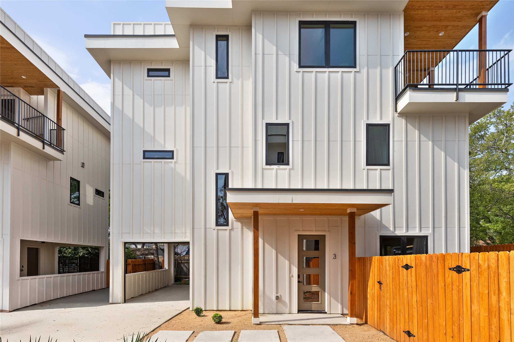 4414 South 1st Street, Unit 3 Austin, TX 78745 - Photo 1 of 39 View of front facade with board and batten siding and a balcony