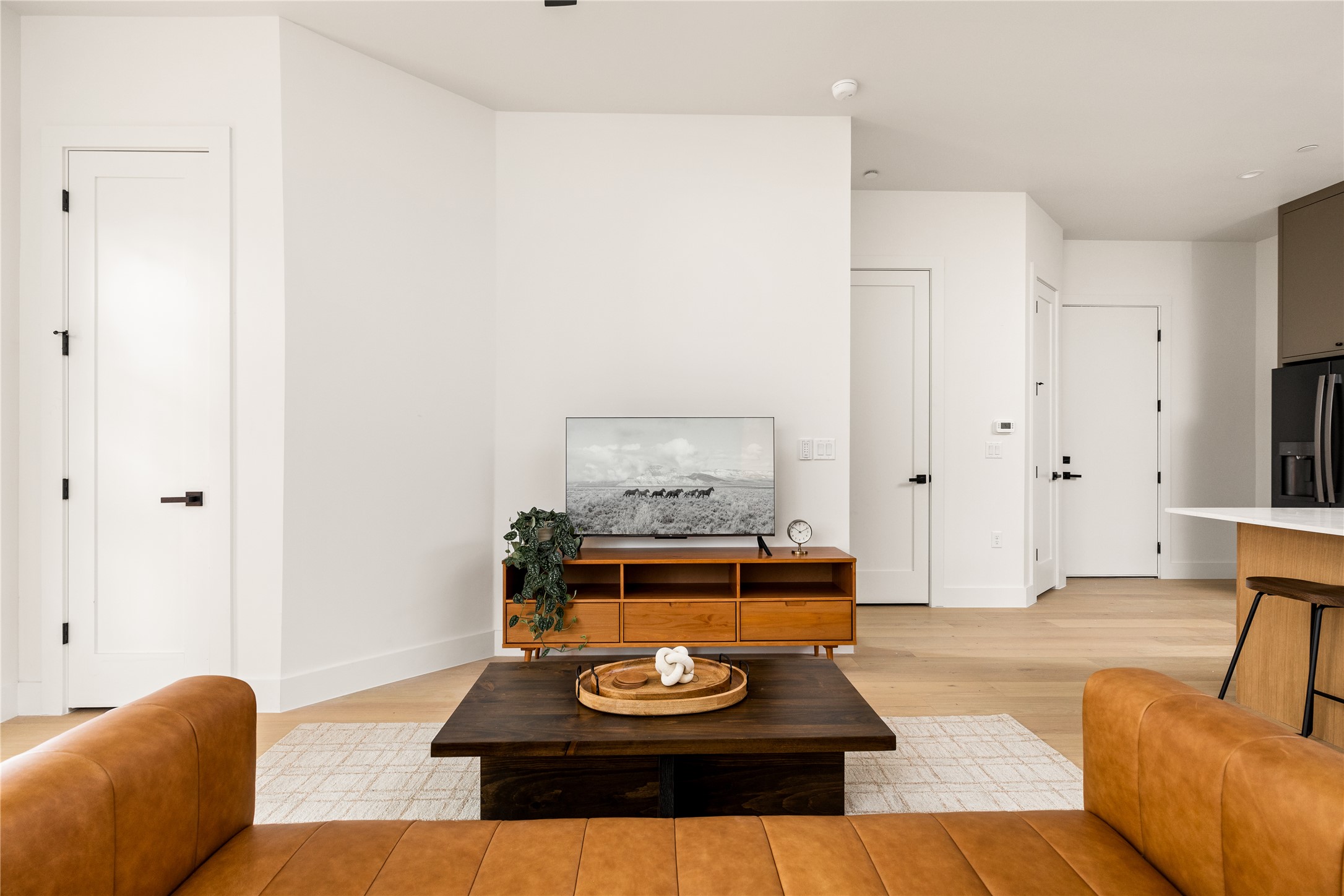 4414 South 1st Street, Unit 3 Austin, TX 78745 - Photo 14 of 39 Living room with light wood-style floors and baseboards