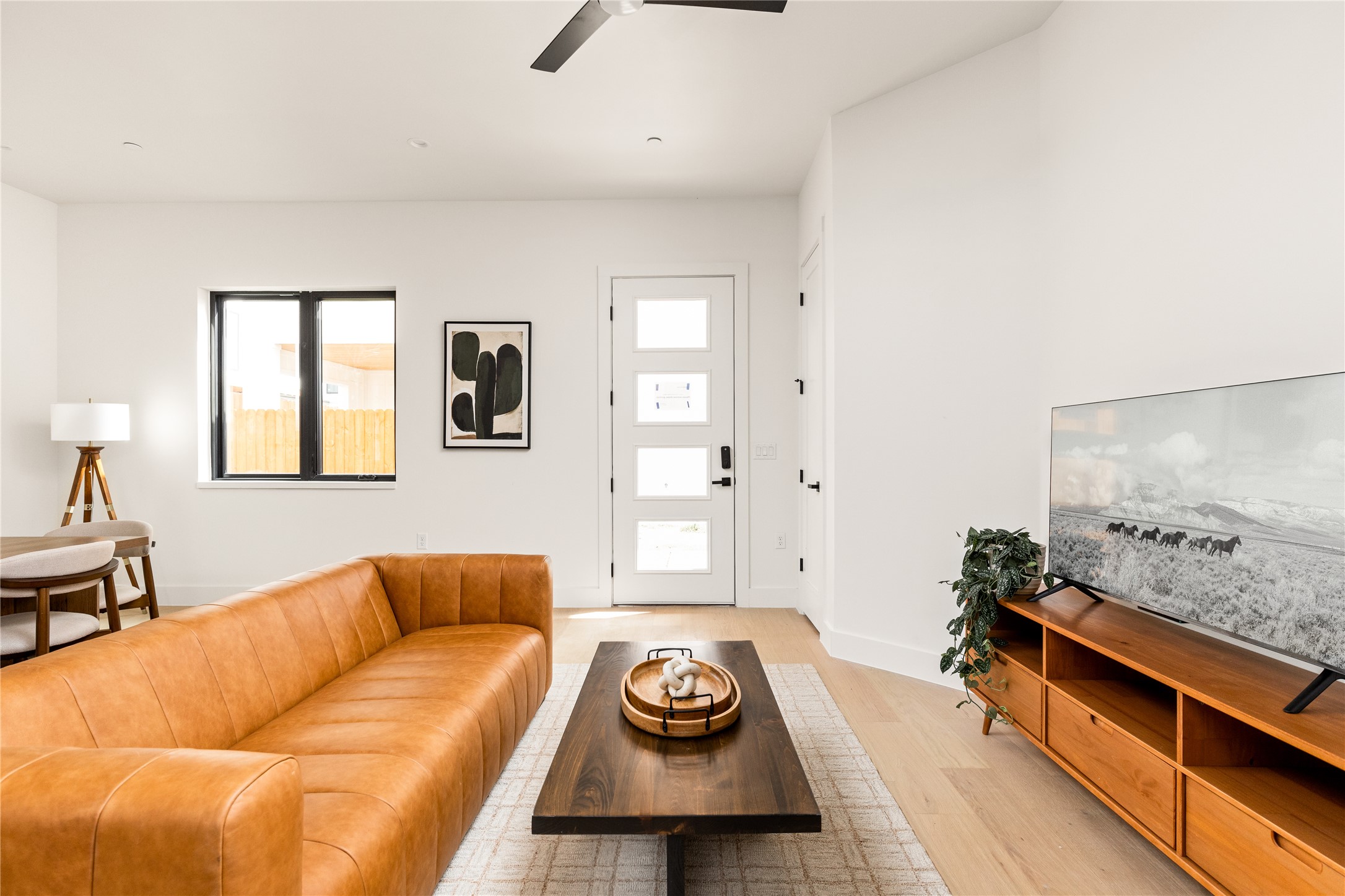 4414 South 1st Street, Unit 3 Austin, TX 78745 - Photo 15 of 39 Living area with light wood finished floors and a ceiling fan